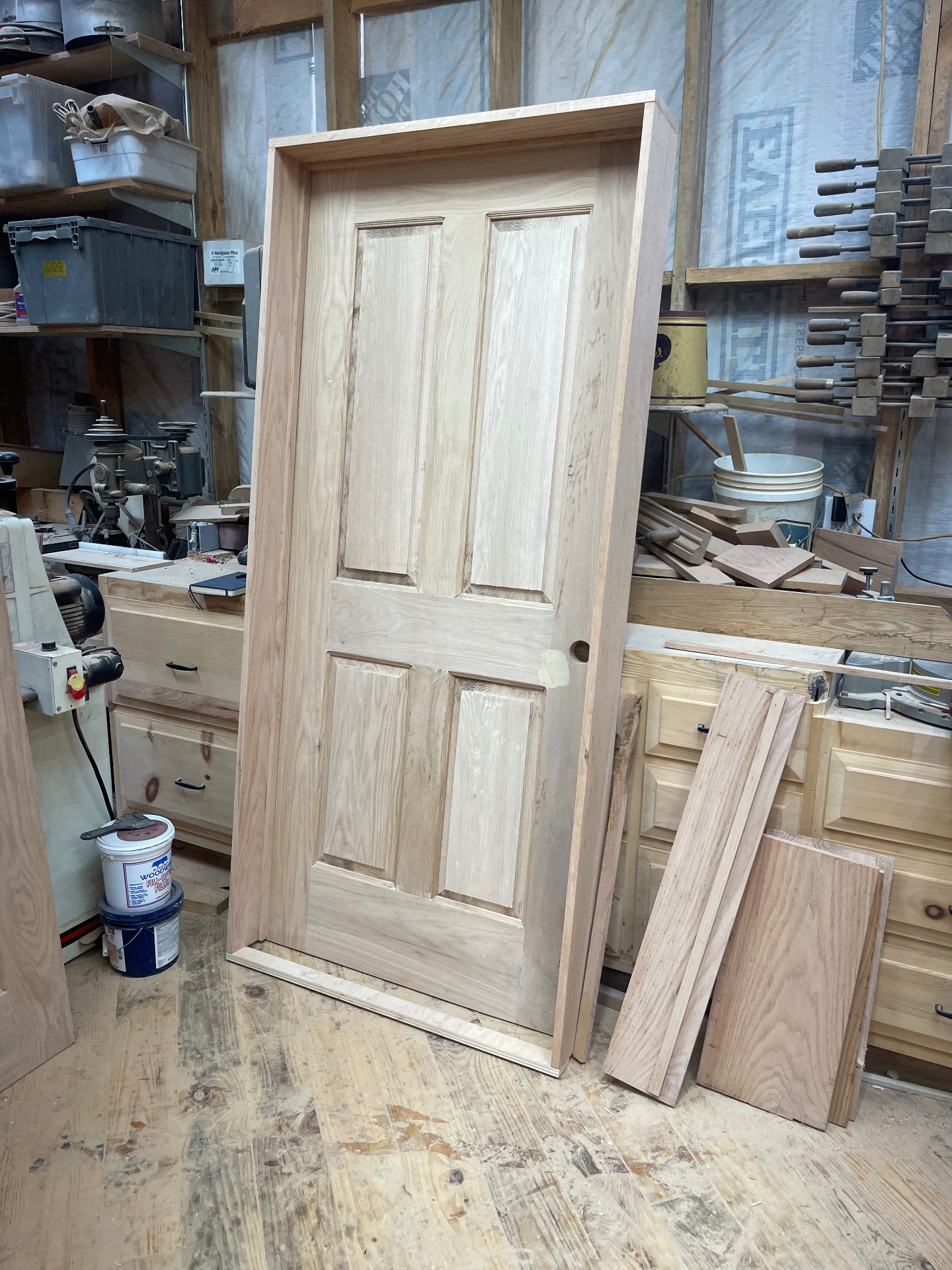 Unfinished custom four-panel interior door in the Knoxville shop